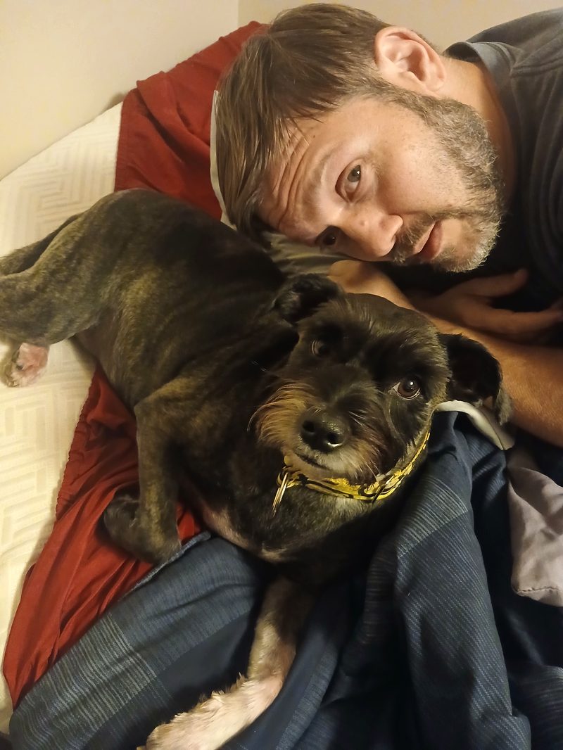 Leia's husband and her dog Layla looking at the camera together
