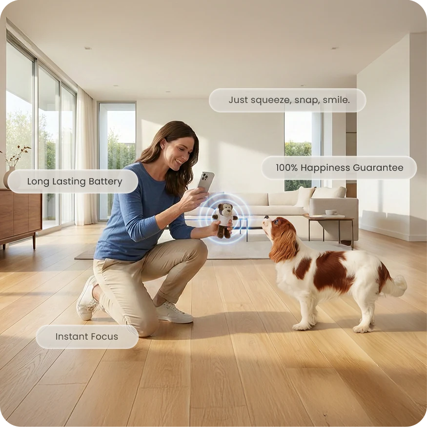A woman holding the Squeak N Snap Joy Capture Kit beside a Cavalier King Charles Spaniel in a bright living room